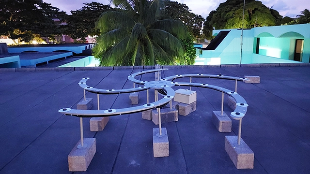 The fully assembled TART spiral antenna array is located on the roof of an Engineering Laboratory building on the Bel Air Campus of Université des Mascareignes. [CREDIT: Dr Tim Molteno]

